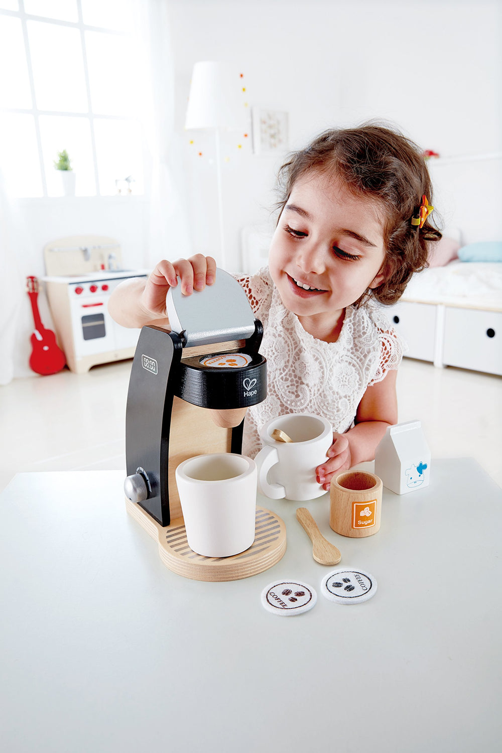 Hape coffee pods and accessories show off the pod area for interactive play.
