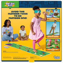 Hasbro Gaming Don't Step in It! Blindfolded player crossing the mat amid giggles