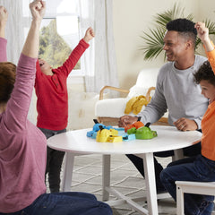 Hasbro Hungry Hungry Hippos players press tails to speed the chomp.