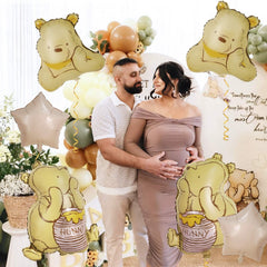 Heboland Pooh honey pot foil balloon enhances birthday party décor.
