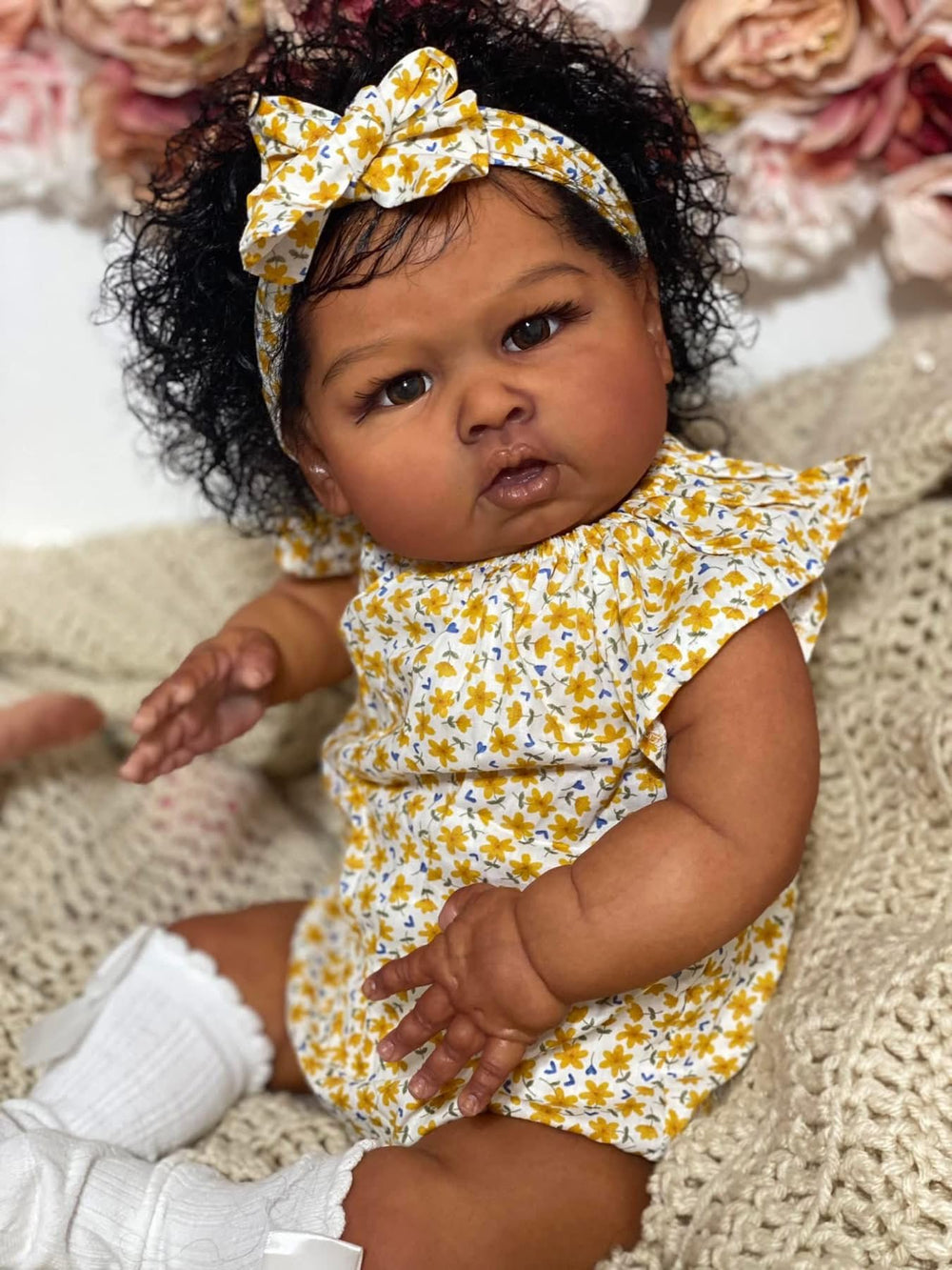Hengluck African American newborn doll with movable limbs for lifelike play.