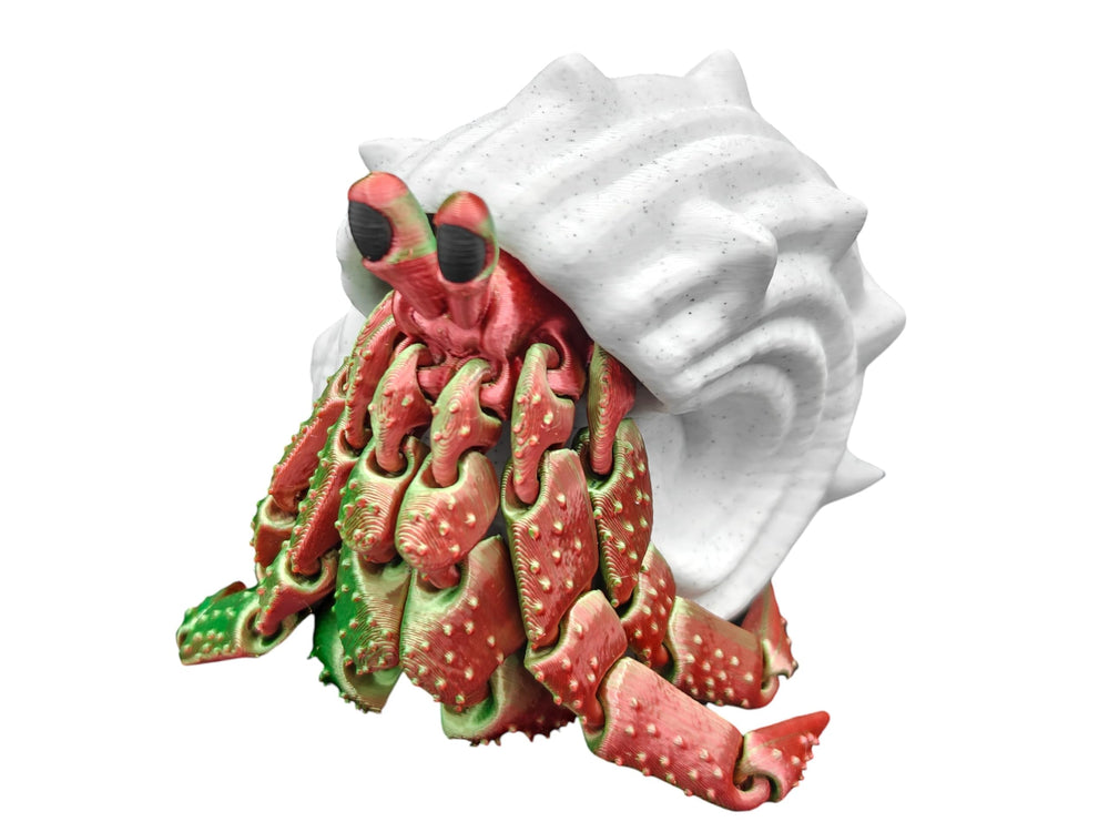 Hermit Crab Articulated Toy on a desk as decorative piece.