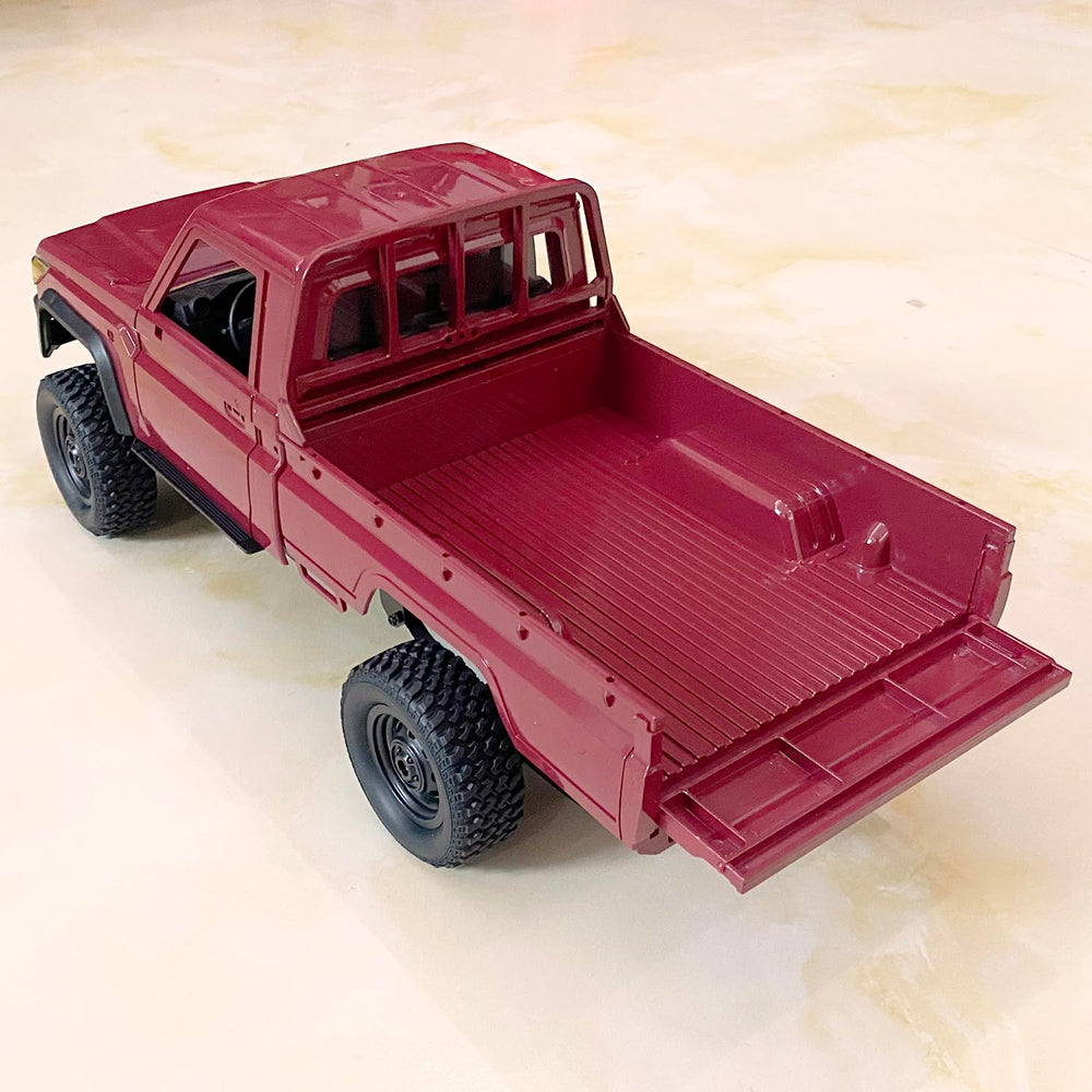HLSFWDRIVE MN82 RC Rock Crawler side view highlights scale and durable chassis for rugged terrain