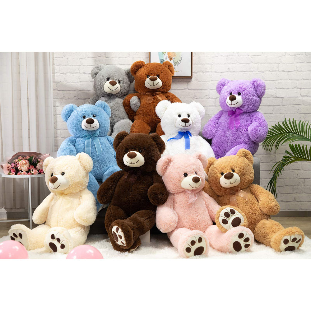 HollyHOME giant teddy bear displayed on bed for a focal bedroom piece.