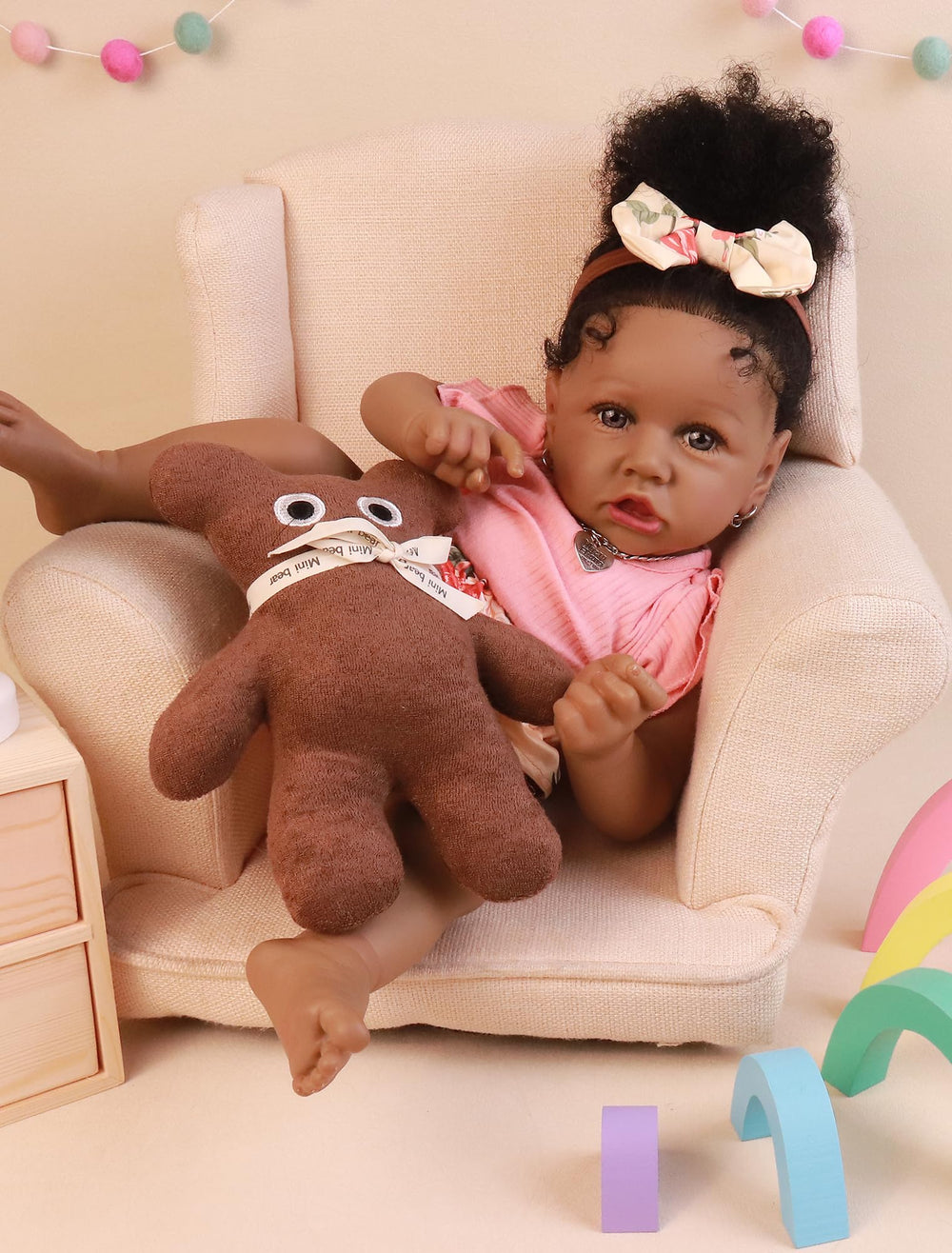 HOOMAI African American reborn doll close-up showing blue eyes and lifelike expression.