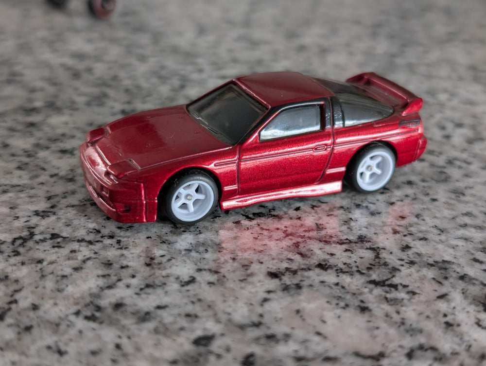 Hot Wheels 1:64 wheel assembly for satisfying builds.