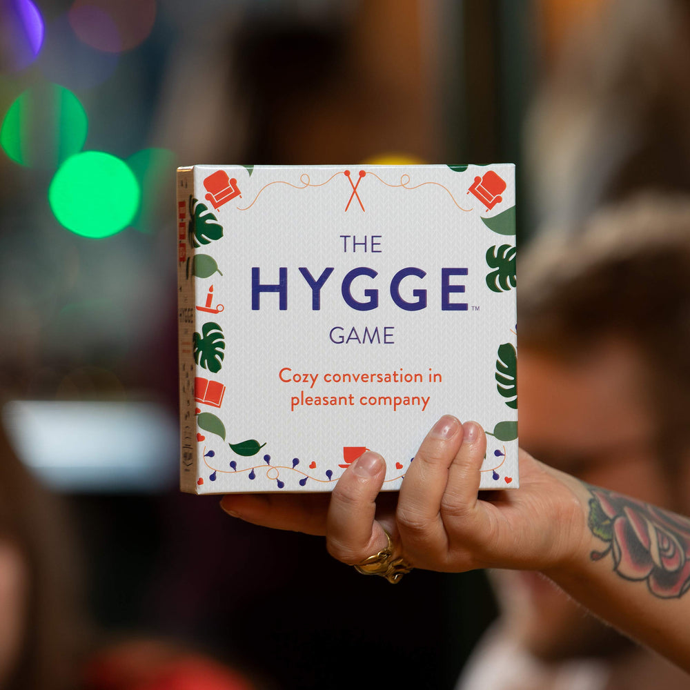 The Hygge Game white box ready for a cozy, low-pressure game night with loved ones.
