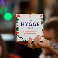 The Hygge Game white box ready for a cozy, low-pressure game night with loved ones.