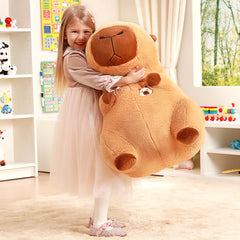 IKASA Capybara plush on a bed provides cozy decor.
