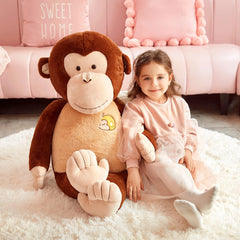 IKASA playtime setup showing a child cuddling the monkey toy