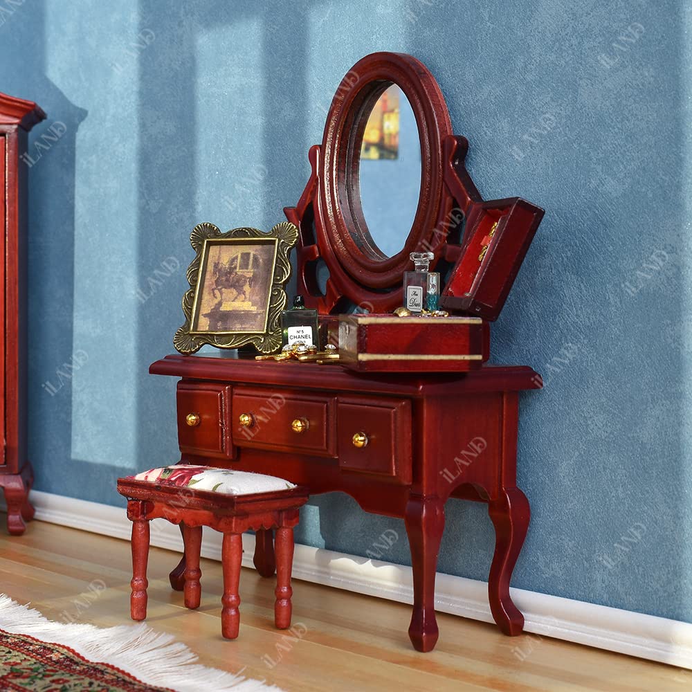Iland wardrobe in mahogany with refined silhouette and enclosed storage in miniature