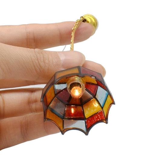 iland mosaic lattice dollhouse lamp casts colorful patterns through its shade.