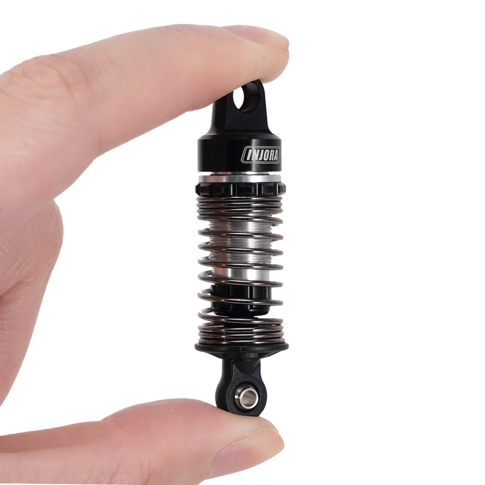 INJORA 59mm aluminum oil shocks offering three spring rates for terrain adaptation