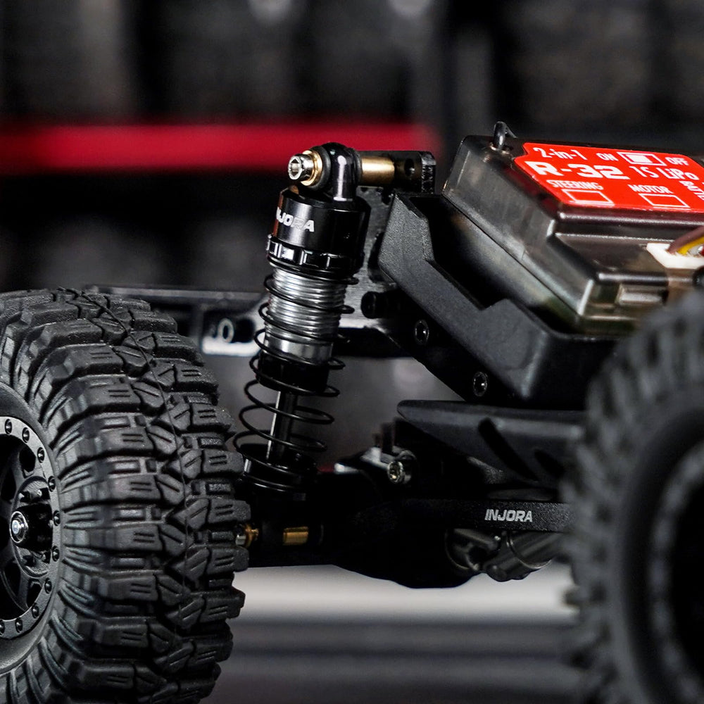 INJORA compact RC shocks ASC32 fit 1/32 scale models for stable handling.