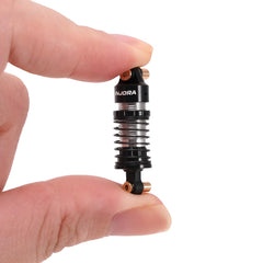 INJORA pre-load-ready ASC32 shocks simplify setup before a race.