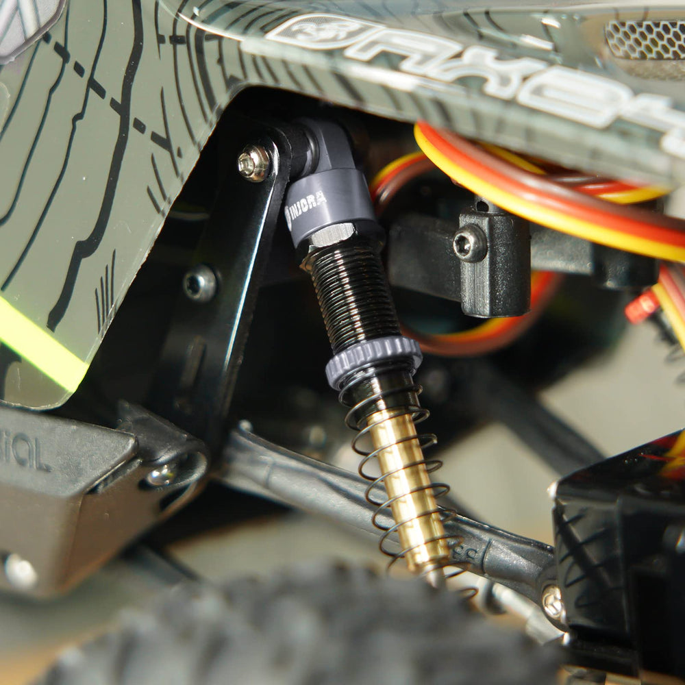 INJORA spring-rate options for tuning RC crawler balance.