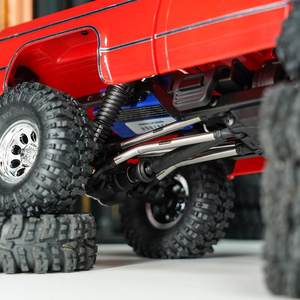 INJORA high clearance chassis links enable smoother ascents on trails.