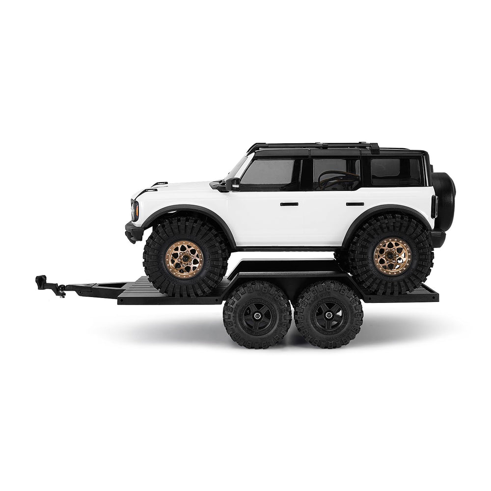 Versatile trailer for towing and transporting RC gear on trail runs.