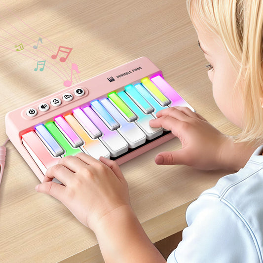 iPlay iLearn kids mini piano with rainbow lights, front view, portable learning companion