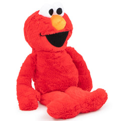 Jay Franco Sesame Street Elmo pillow in bed ready for bedtime snuggles.