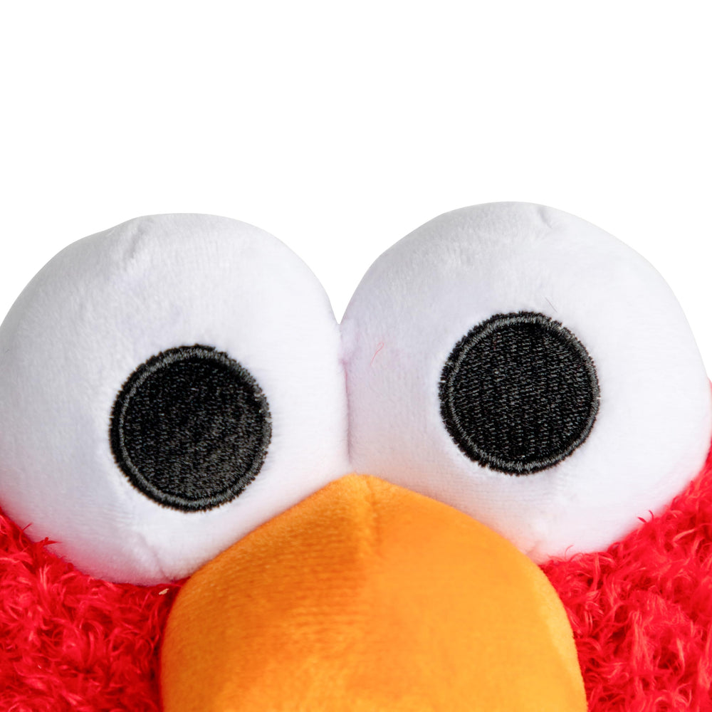 Jay Franco Elmo weighted plush in a bedroom adds playful decor and comfort.
