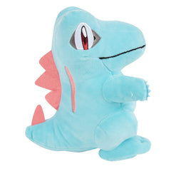 Jazwares Totodile plush hug pose, inviting cozy moments at home or travel.