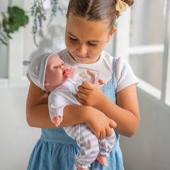 Removable outfit on Berenguer Boutique doll supports dressing.