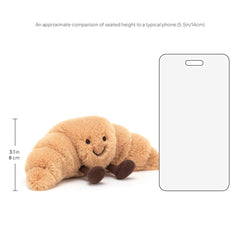 Jellycat Amuseables Croissant plush side profile highlighting huggable shape