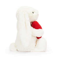 Jellycat Bashful nose detail with pink suedette accent adds playful charm.