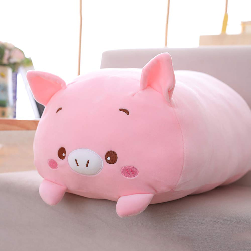 Jensquaify pig plush pillow on a bed providing cuddle-friendly support.