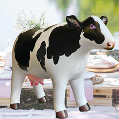 Jet Creations cow inflatable showcases colorful imprints for lifelike charm.