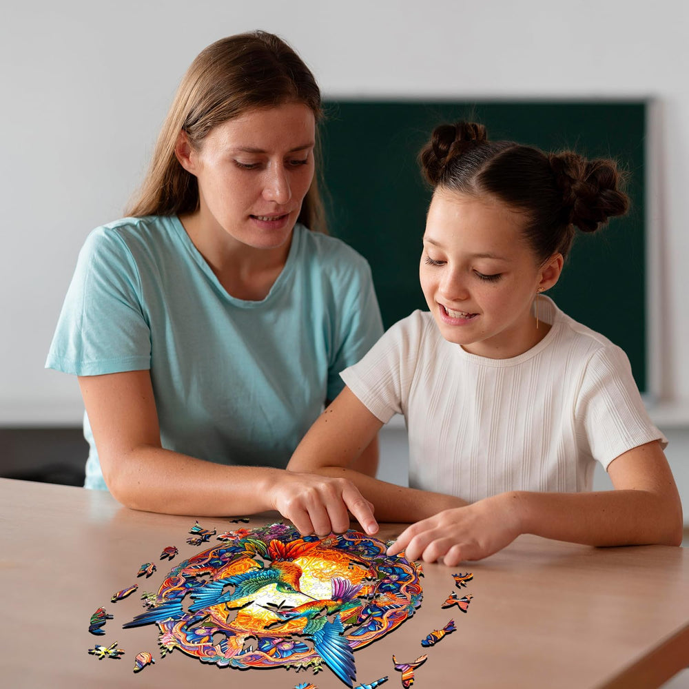 Jigfoxy hummingbird puzzle pieces spread on wood grain inviting focused play.