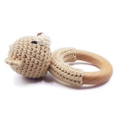 Joliecraft bear rattle features soft cotton and wood teether for soothing tactile play.