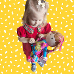 June Garden Belle plush supports sensory and motor development during pretend dressing