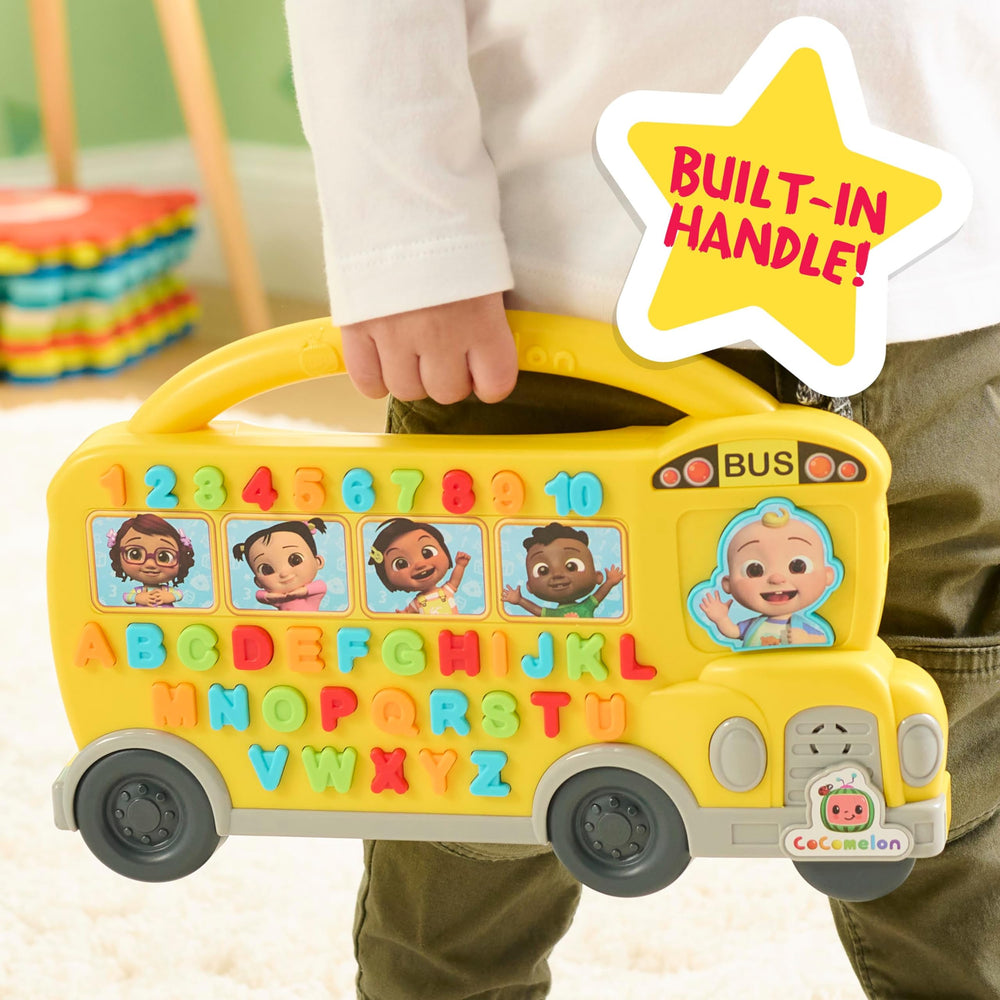 Just Play Cocomelon Learning Bus JJ driver button activates songs for interactive play.
