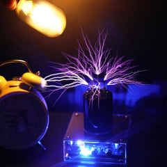JZENT Tesla coil arc around the middle tip emitting strong glow.