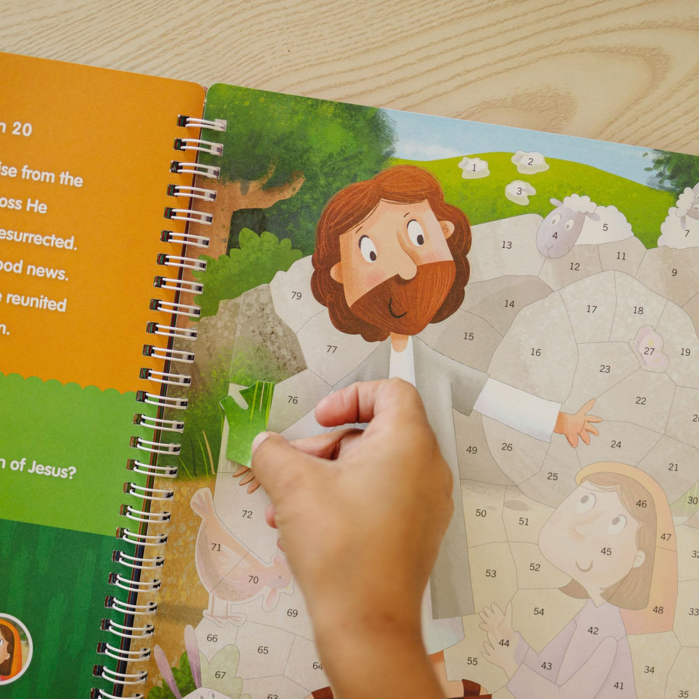 KangaToys child placing stickers scene to boost fine motor skills.