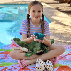 Karister crocodile plush with open belly zipper for 7-in-1 interactive play.