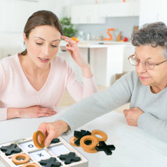 Keeping Busy dexterity wooden pieces image emphasizes hand-eye coordination during play.