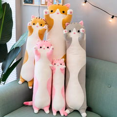 Kekeso giant cat pillow on sofa, adds playful decor and comfort.