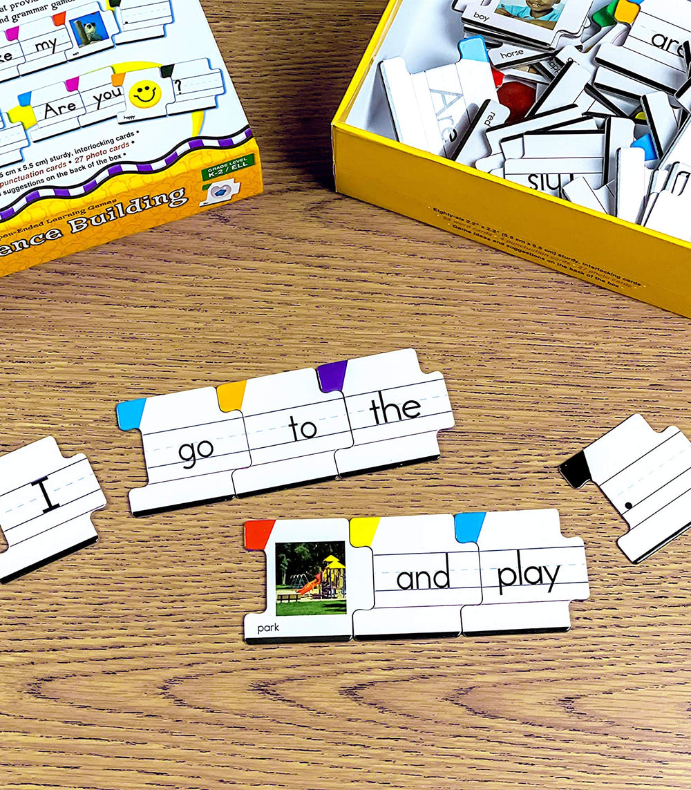 Key Education sentence strips show progress as learners assemble simple sentences.