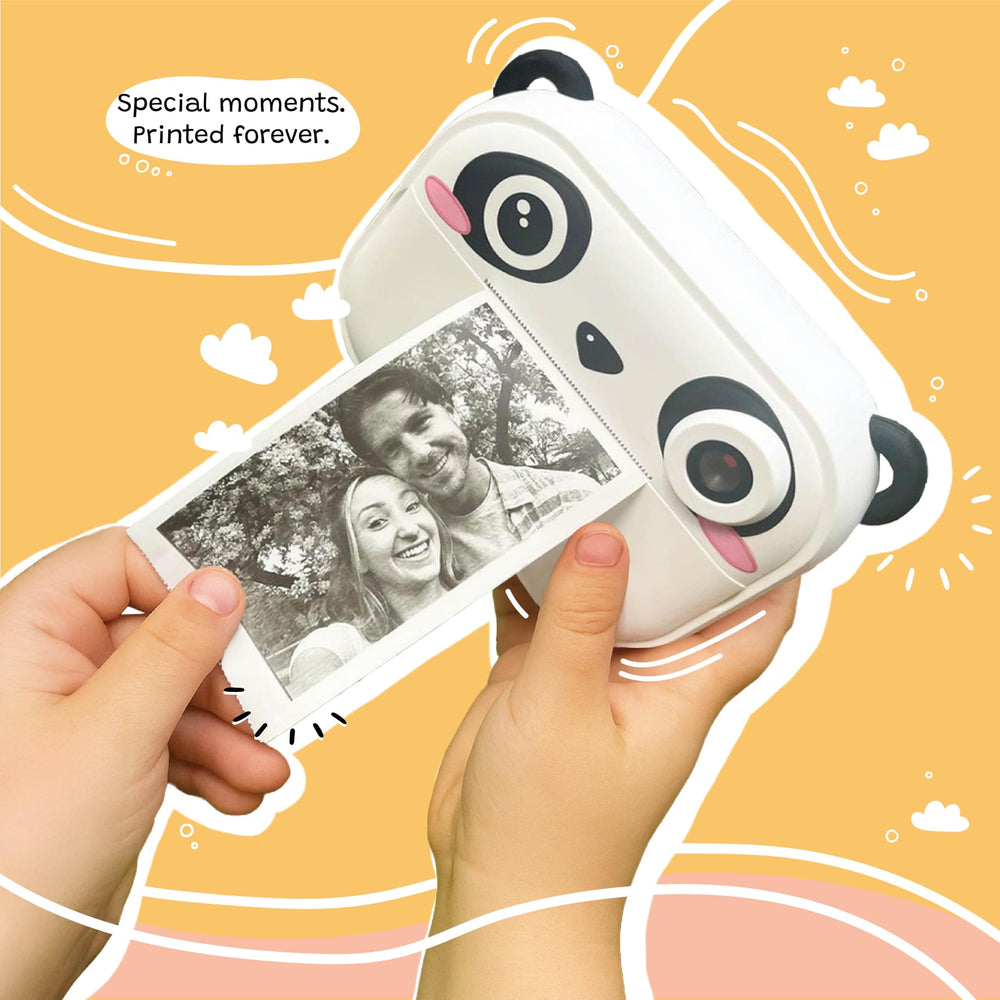 Kidamento instant print camera loading paper indicating easy setup for prints.