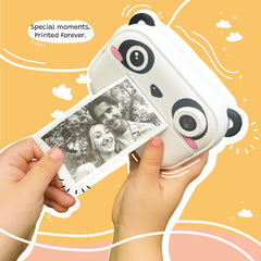 Kidamento instant print camera loading paper indicating easy setup for prints.