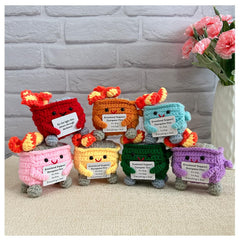 KivTovMo crochet dumpster fire on desk adds playful charm and conversation starter.