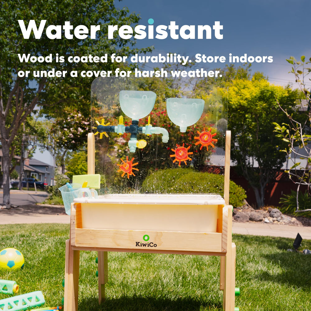 KiwiCo water and sand sensory table hydraulic play demonstrates simple engineering for toddlers.