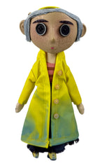 KOBOSY NECA Coraline doll in yellow raincoat shown on a shelf for display