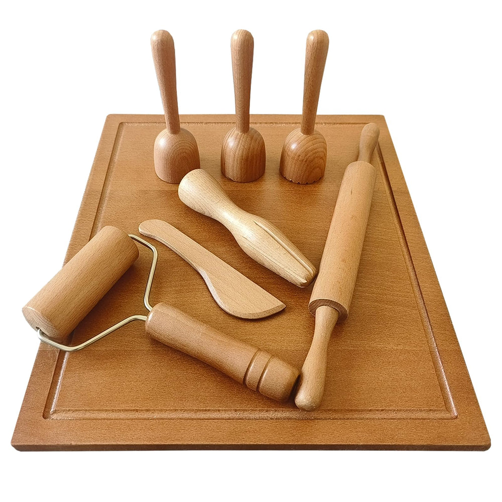 KODMIS squeezer tool creating smooth dough textures during play.