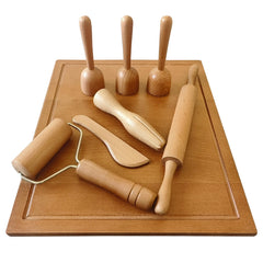 KODMIS squeezer tool creating smooth dough textures during play.