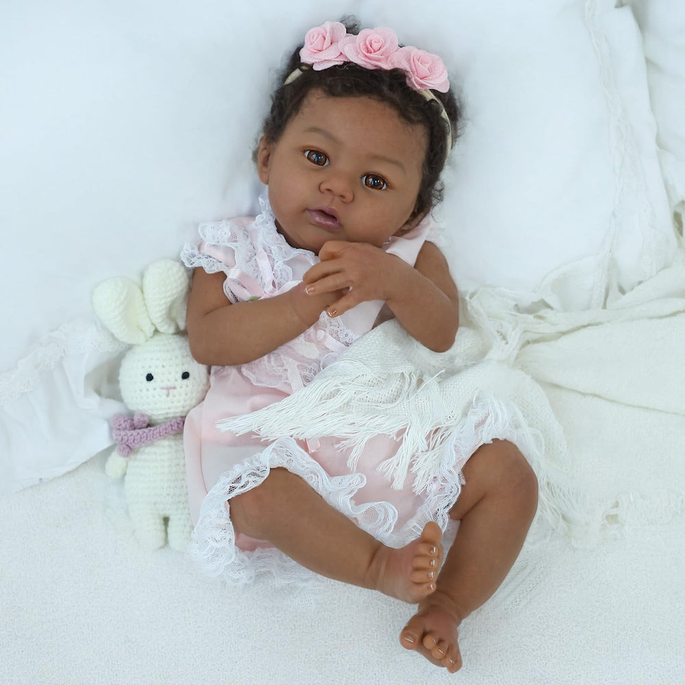 KSBD Reborn Baby Doll Black Girl 18-Inch pink dress invites sweet dress-up play.