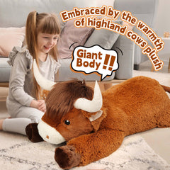 Ksidzas Highland cow plush resting on bed as cozy decor.